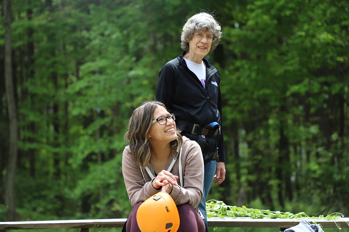 Multigenerational women preparing to go on the zip line for a Deep Water adventure