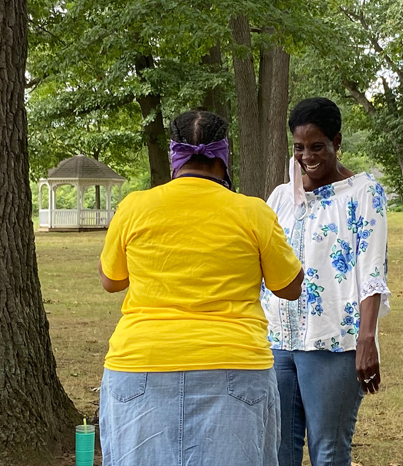 Woman giggling during a team building activity