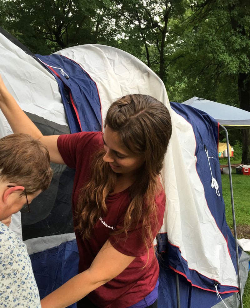 Women putting up a tent for a Deep Water retreat