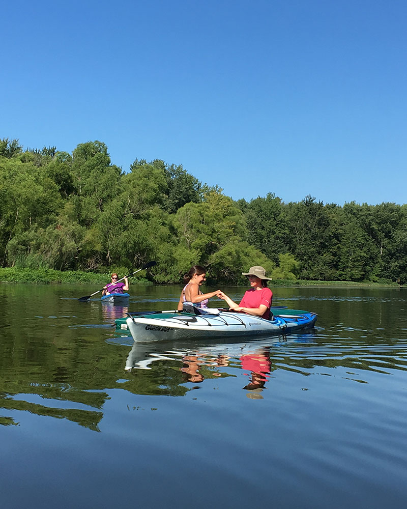 Two women kayaking with Deep Water Ministries